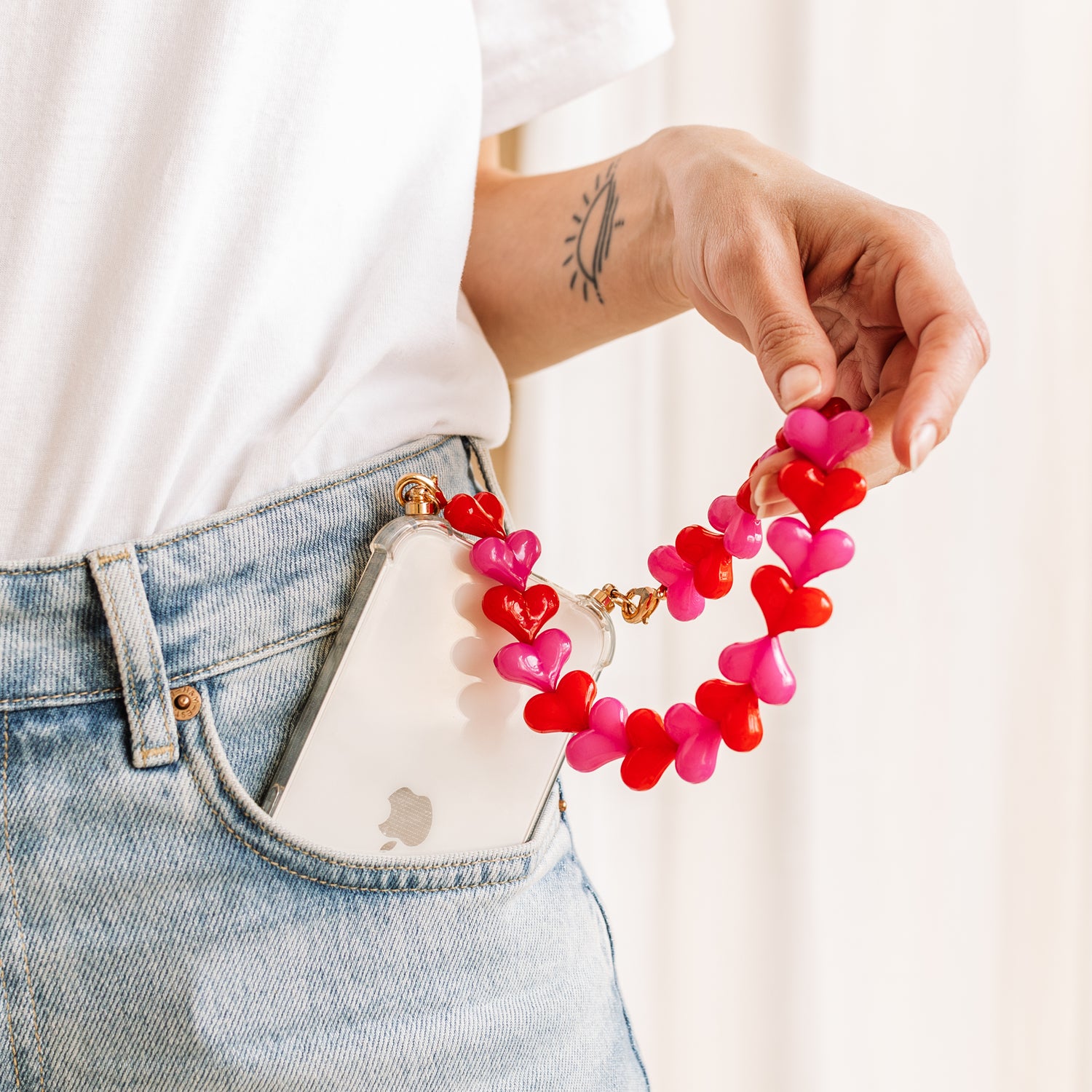 Phone case with red &amp; pink hearts cord