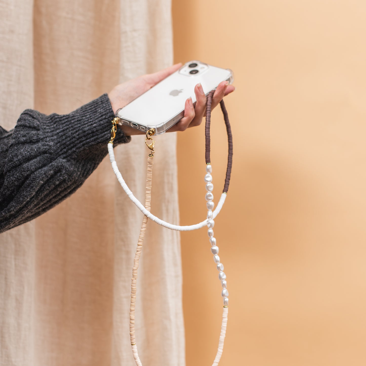 Phone case with long and short cozy cord
